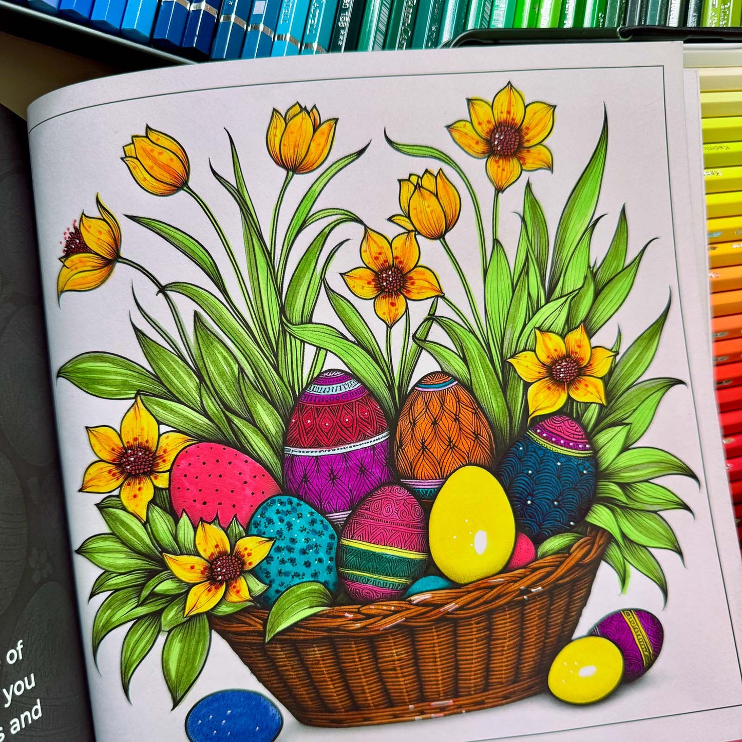 Coloring in progress — basket of decorated Easter eggs with flowers and pencils — from Easter Magic (ages 4–8) | MATI Publishing